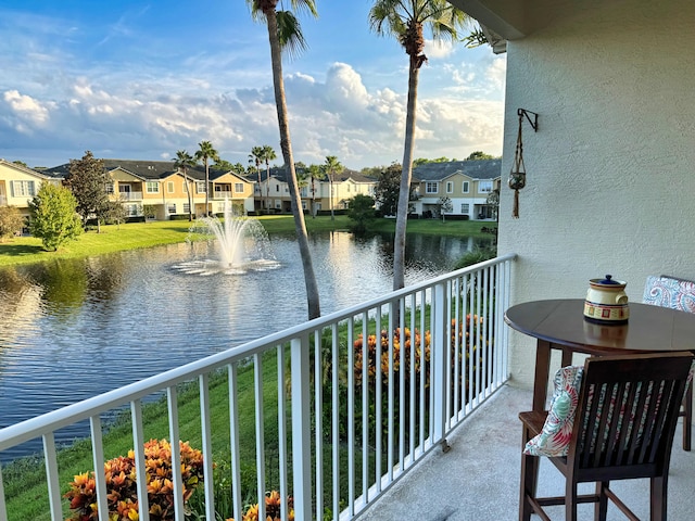 balcony featuring a water view