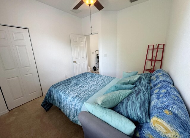 bedroom featuring carpet, ceiling fan, and a closet