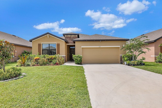 view of front of property featuring a garage and a front yard