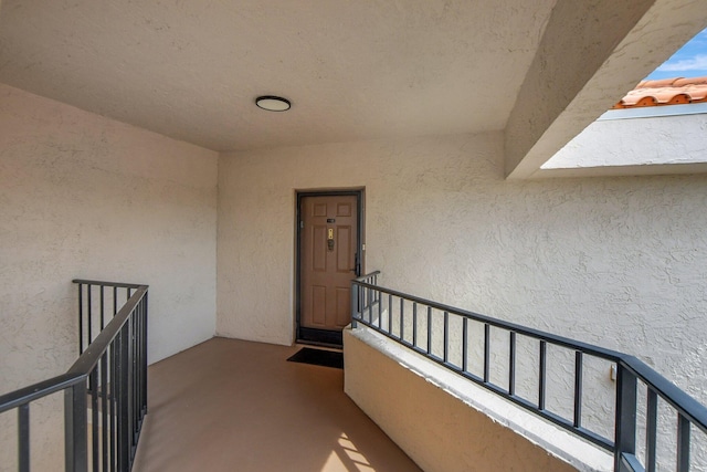 entrance to property featuring a balcony