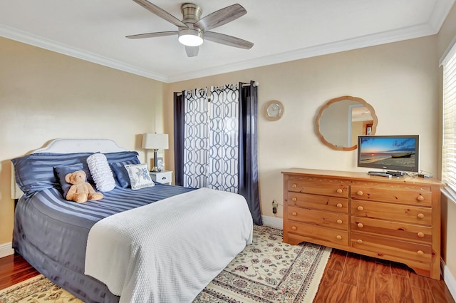 bedroom featuring ornamental molding, dark hardwood / wood-style floors, and ceiling fan