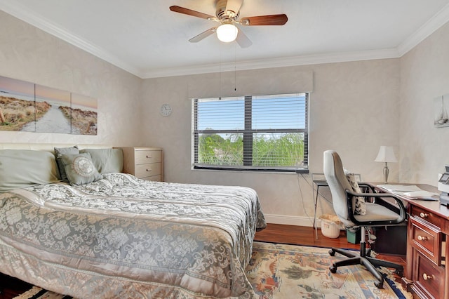 bedroom featuring ornamental molding, hardwood / wood-style floors, and ceiling fan