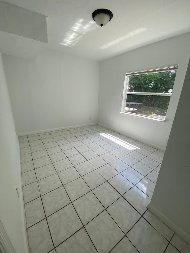 view of tiled spare room