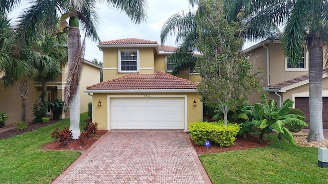 mediterranean / spanish home featuring a garage and a front lawn