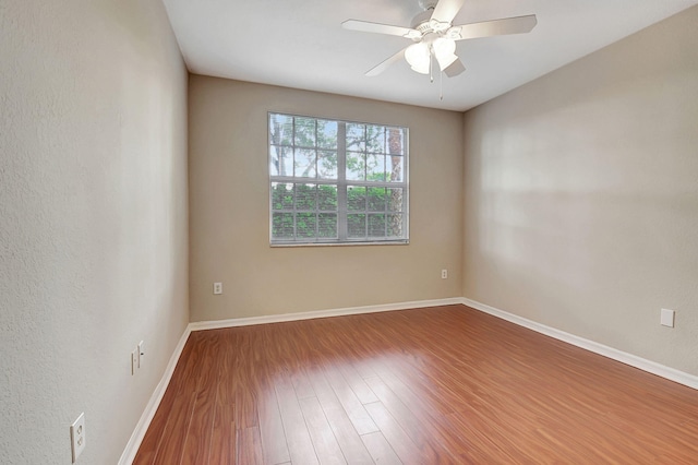 empty room featuring ceiling fan and wood-type flooring