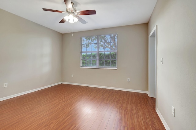 spare room featuring ceiling fan and wood-type flooring