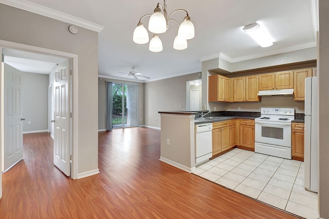 kitchen with white appliances, light hardwood / wood-style floors, ornamental molding, and pendant lighting