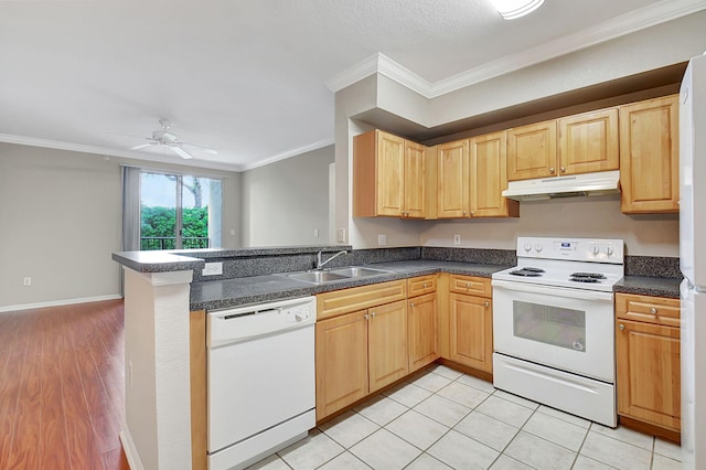 kitchen with white appliances, sink, kitchen peninsula, crown molding, and light hardwood / wood-style flooring