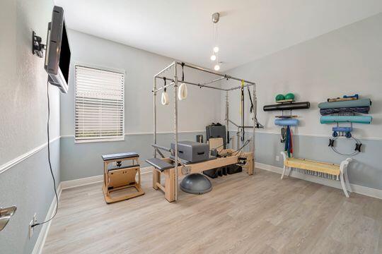 workout area featuring light hardwood / wood-style flooring