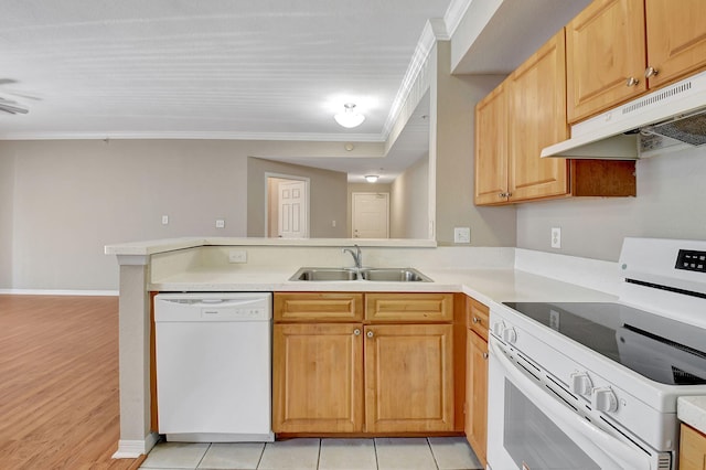 kitchen featuring kitchen peninsula, ornamental molding, sink, light wood-type flooring, and white appliances