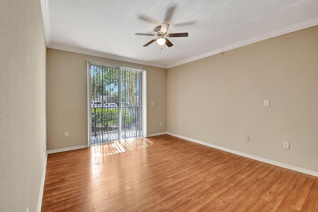 unfurnished room featuring light hardwood / wood-style flooring, ornamental molding, and ceiling fan