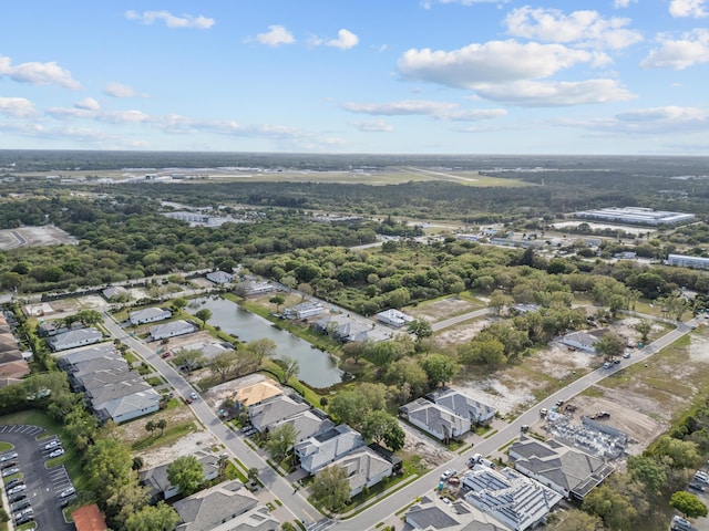 bird's eye view with a water view and a residential view