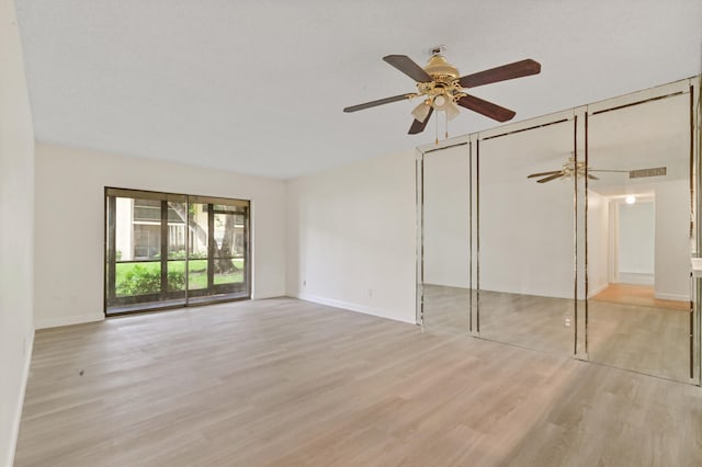 unfurnished bedroom featuring light hardwood / wood-style floors, access to outside, and ceiling fan