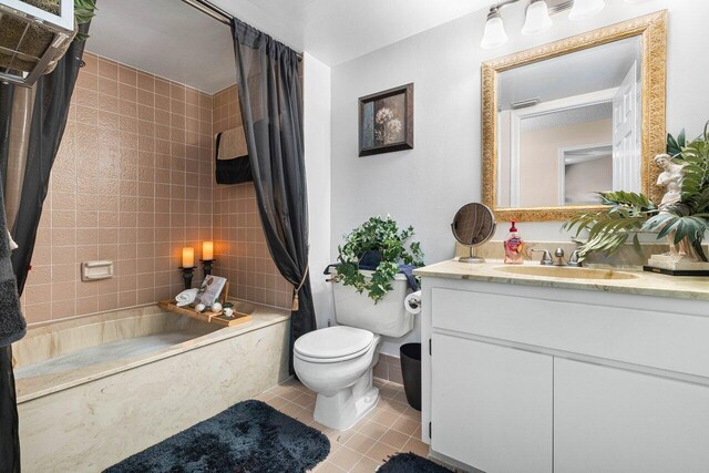 full bathroom with vanity, toilet, tile patterned floors, and shower / bathtub combination with curtain