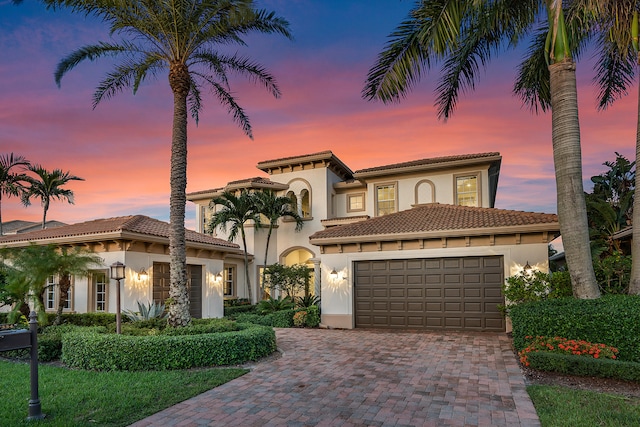 mediterranean / spanish-style house featuring a garage