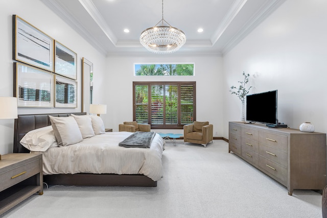 bedroom featuring a chandelier, light colored carpet, and a tray ceiling