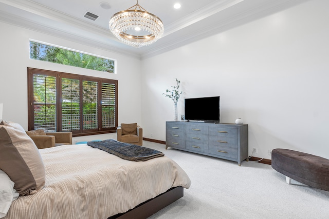 bedroom with a tray ceiling, light colored carpet, ornamental molding, and an inviting chandelier