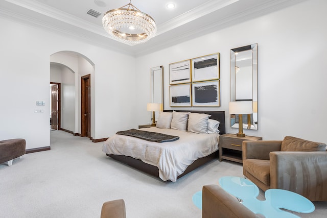 carpeted bedroom featuring a raised ceiling, an inviting chandelier, and crown molding