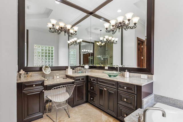 bathroom featuring a bathing tub, vanity, and a chandelier