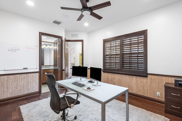 home office featuring ceiling fan and dark wood-type flooring