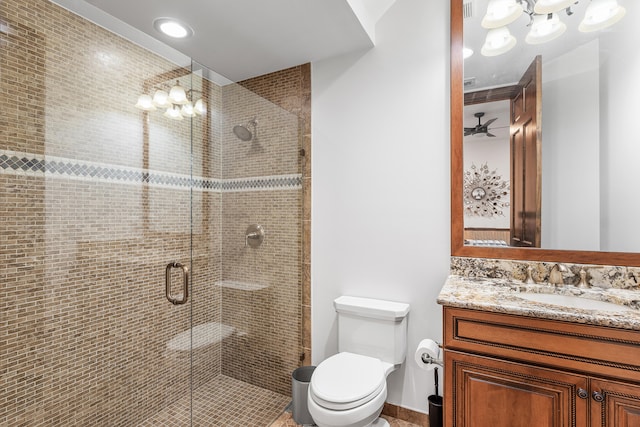 bathroom with walk in shower, toilet, vanity, and an inviting chandelier