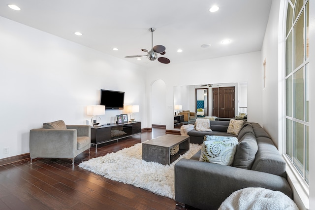 living room featuring hardwood / wood-style floors and ceiling fan