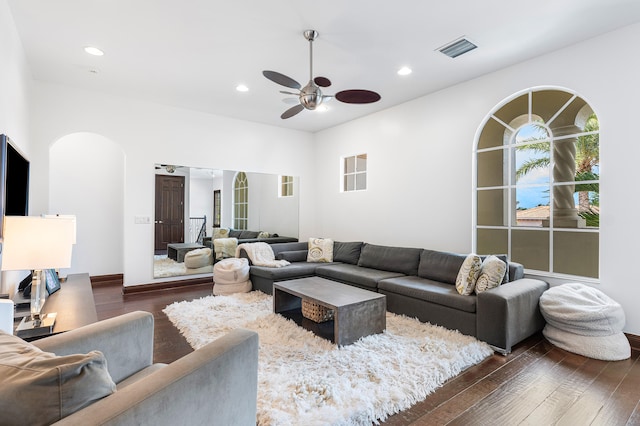 living room featuring dark hardwood / wood-style floors and ceiling fan