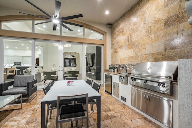 interior space featuring ceiling fan, fridge, tile walls, and light tile patterned floors