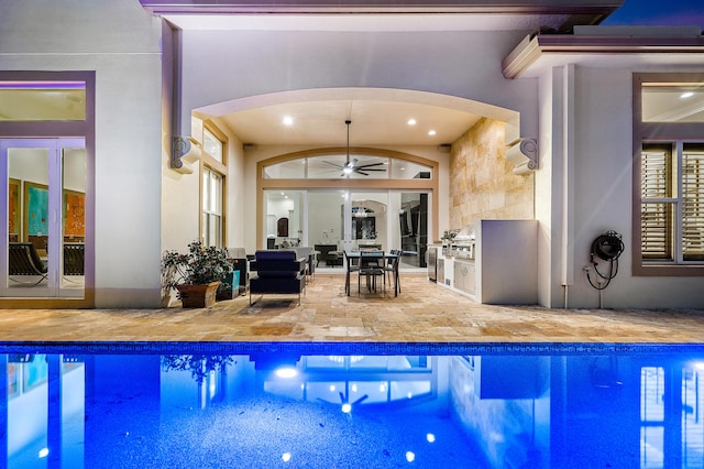 view of pool with ceiling fan