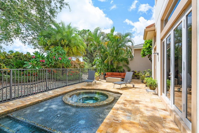 view of pool with an outdoor hangout area, an in ground hot tub, and a patio area