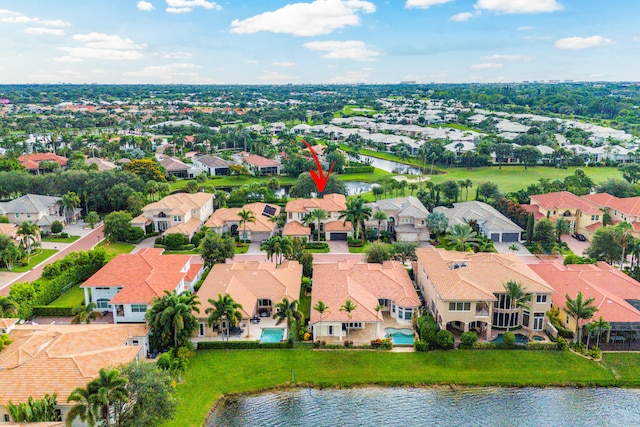 birds eye view of property with a water view