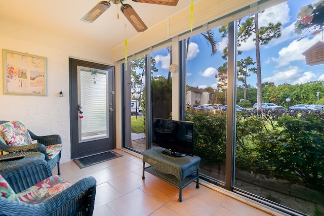 sunroom / solarium with ceiling fan and a wealth of natural light