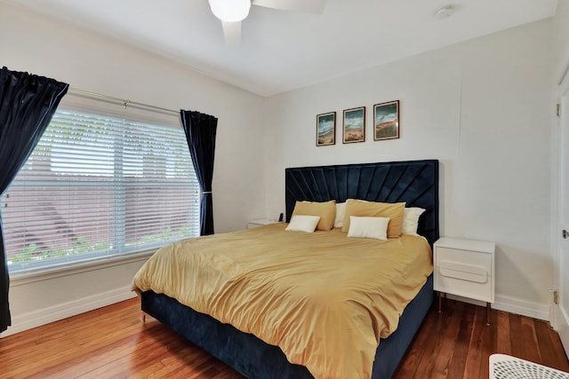 bedroom featuring hardwood / wood-style flooring and ceiling fan