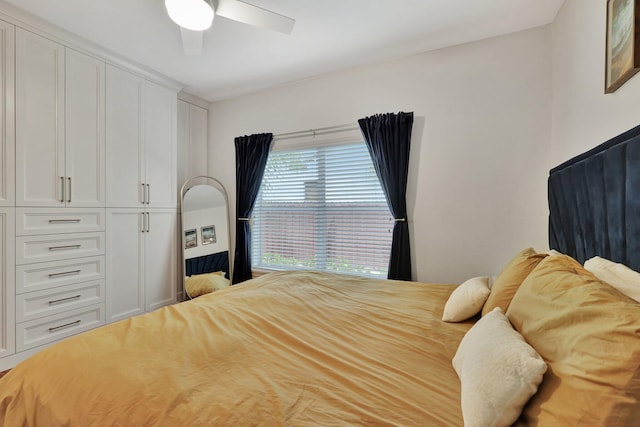 bedroom featuring ceiling fan and a closet