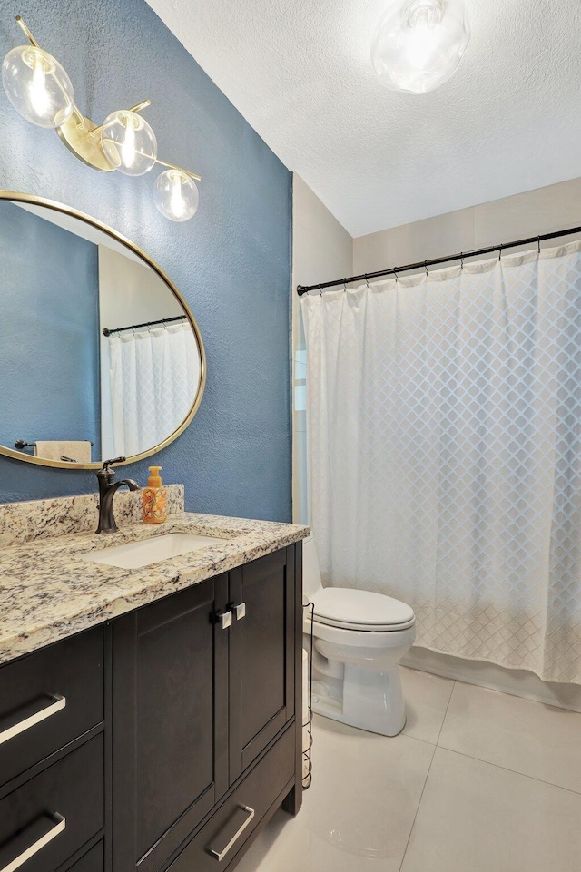 bathroom featuring a textured ceiling, toilet, tile patterned floors, and vanity