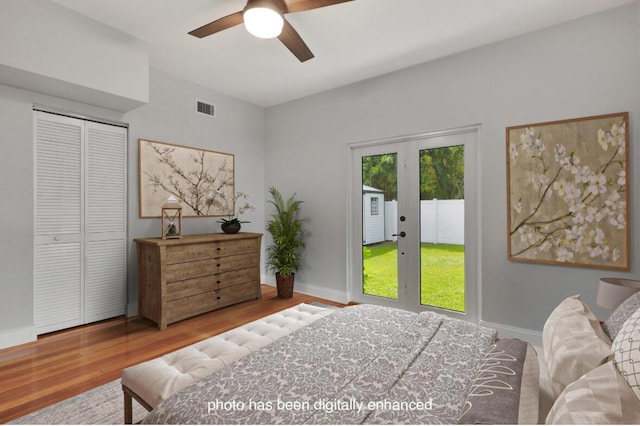 bedroom featuring french doors, access to outside, a closet, ceiling fan, and hardwood / wood-style floors