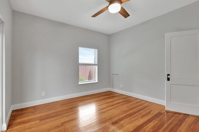 empty room featuring ceiling fan and light wood-type flooring