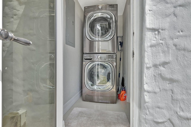 laundry area with stacked washer / dryer