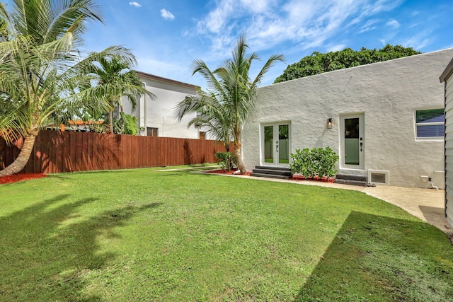 view of yard with french doors