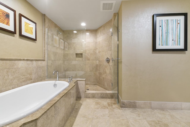 bathroom with separate shower and tub