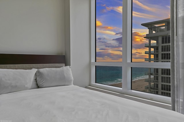 unfurnished bedroom with a water view