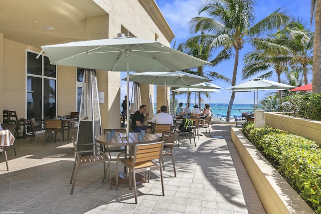 view of patio featuring a water view