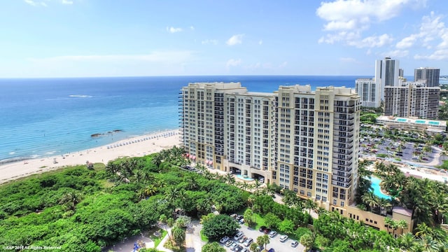 birds eye view of property featuring a view of the beach and a water view