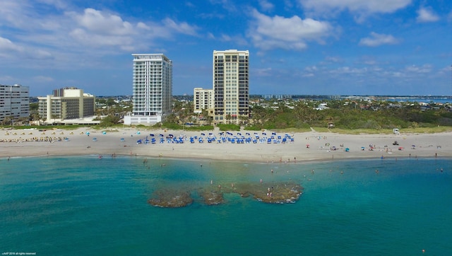 aerial view featuring a water view and a beach view