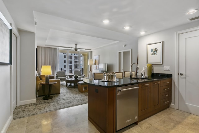 kitchen featuring ceiling fan, dishwasher, sink, and light tile patterned floors