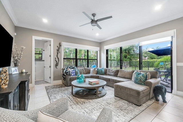 living room with light tile patterned flooring, a textured ceiling, crown molding, and ceiling fan