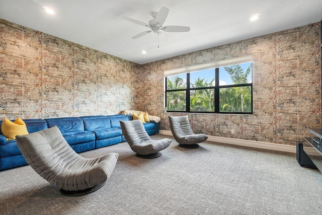 interior space with carpet floors, a textured ceiling, and ceiling fan