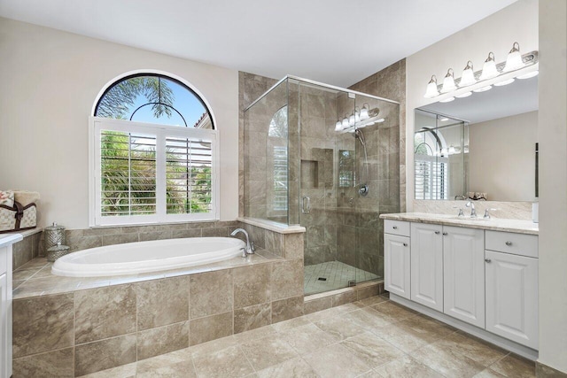 bathroom with vanity, shower with separate bathtub, and tile patterned flooring