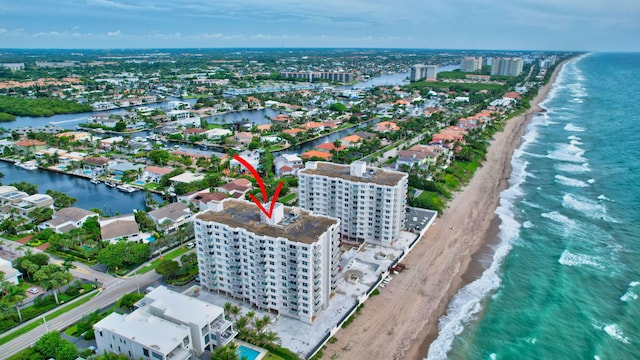 bird's eye view featuring a water view and a view of the beach