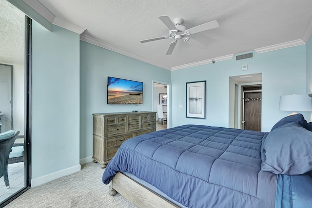 bedroom with ceiling fan, ornamental molding, light colored carpet, and a textured ceiling